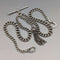 Cadena doble Albert de plata esterlina, antigüedad británica de alrededor de 1900, 34 g, con dije de borla