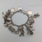 Pulsera de dijes de plata esterlina vintage británica de la década de 1970, 60g