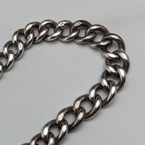 Circa 1900 British antique sterling silver Albert chain, 56g, large two-tone rotating fob