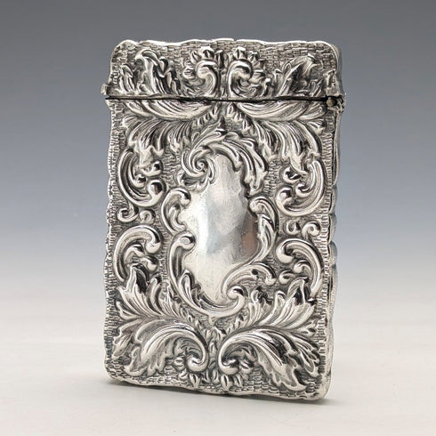 Antique American sterling silver card case with embossed decoration, 75g