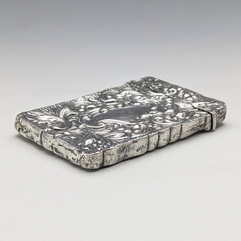 Antique American sterling silver card case with embossed decoration, 75g