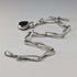 Circa 1900 British antique sterling silver Albert chain, 51g, two-tone natural stone swivel fob