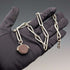 Circa 1900 British antique sterling silver Albert chain, 51g, two-tone natural stone swivel fob