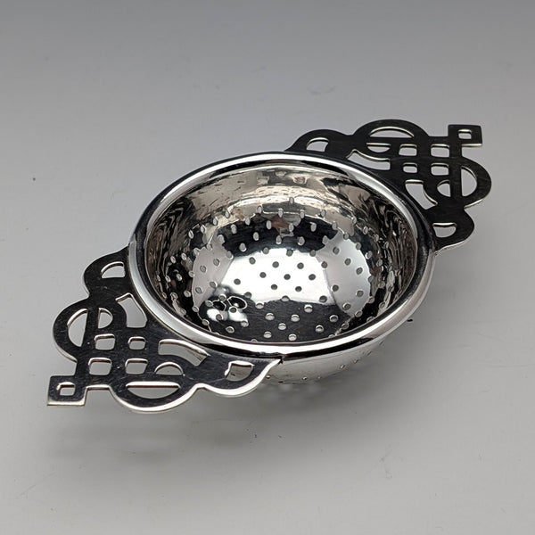 Vintage British silver plate tea strainer