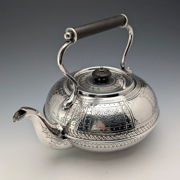 Antique British silver plated tea kettle with Celtic carvings