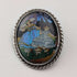 Vintage British sterling silver oval brooch featuring two women with butterfly wings