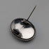 Vintage British sterling silver oval brooch featuring two women with butterfly wings