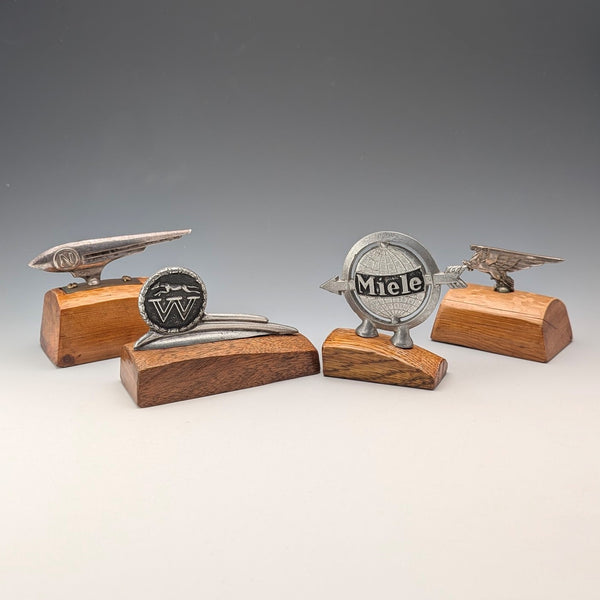 4 vintage Fender mascots with wooden stands