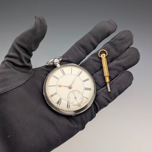 1881 British antique John Cowgill sterling silver pocket watch with key winding mechanism, 53mm diameter, in good working order