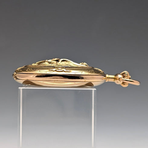 Zenith pocket watch, circa 1913, with dragon relief carving, 18k gold hunter case, in good working order.