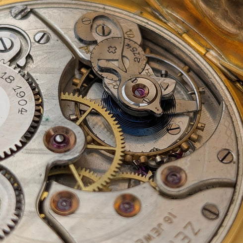 Zenith pocket watch, circa 1913, with dragon relief carving, 18k gold hunter case, in good working order.