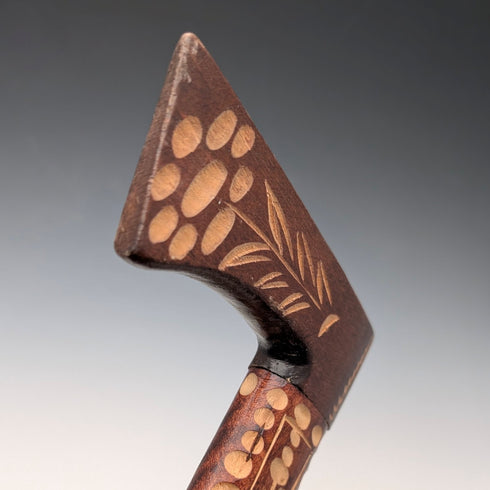 Vintage brown shaft walking stick with carved wood accents and an axe-shaped handle, 85cm