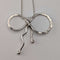 British vintage sterling silver ribbon design pendant with sterling silver chain.