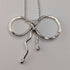 British vintage sterling silver ribbon design pendant with sterling silver chain.