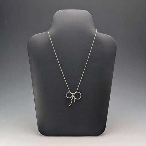 British vintage sterling silver ribbon design pendant with sterling silver chain.