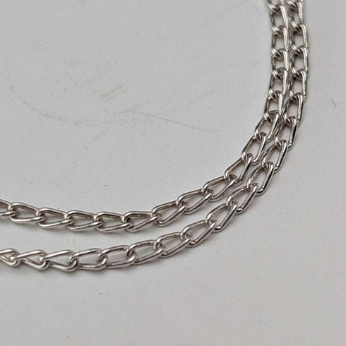 British vintage sterling silver ribbon design pendant with sterling silver chain.