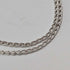 British vintage sterling silver ribbon design pendant with sterling silver chain.