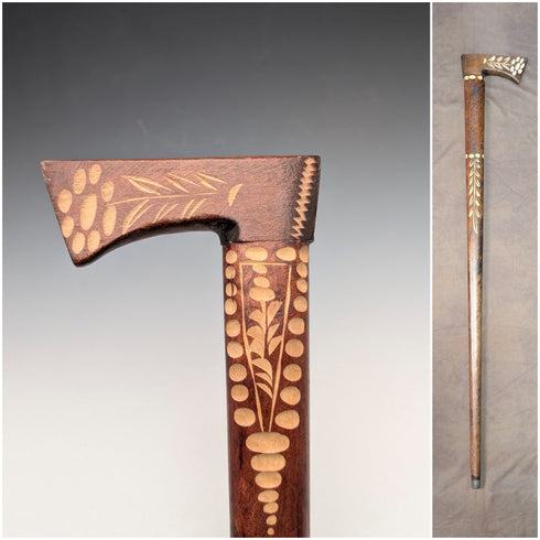 Vintage brown shaft walking stick with carved wood accents and an axe-shaped handle, 85cm