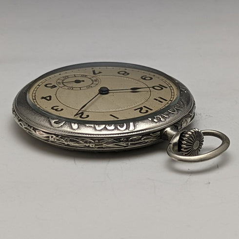 Reloj de bolsillo antiguo sin marca, grabado floral Art Nouveau, caja de aleación, en buen estado de funcionamiento