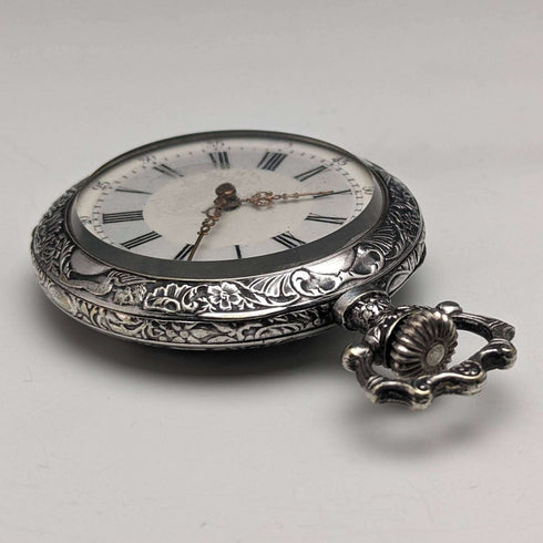 Antique Swiss made unsigned pocket watch with embossed silver plate case works well