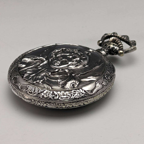 Antique Swiss made unsigned pocket watch with embossed silver plate case works well