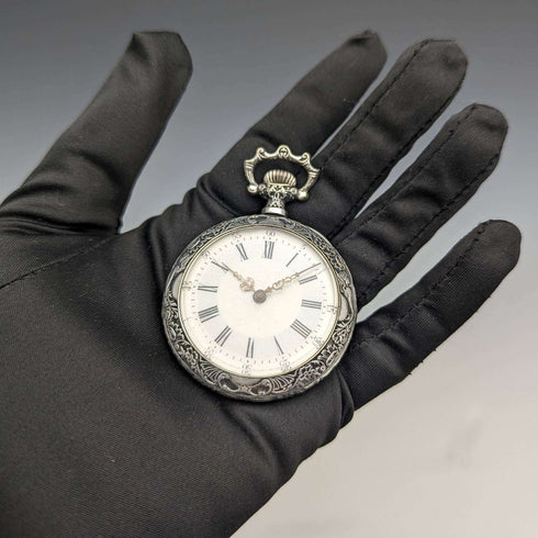 Antique Swiss made unsigned pocket watch with embossed silver plate case works well